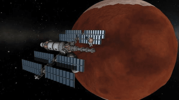 Space station with solar arrays orbiting a red planet in Kerbal Space Program